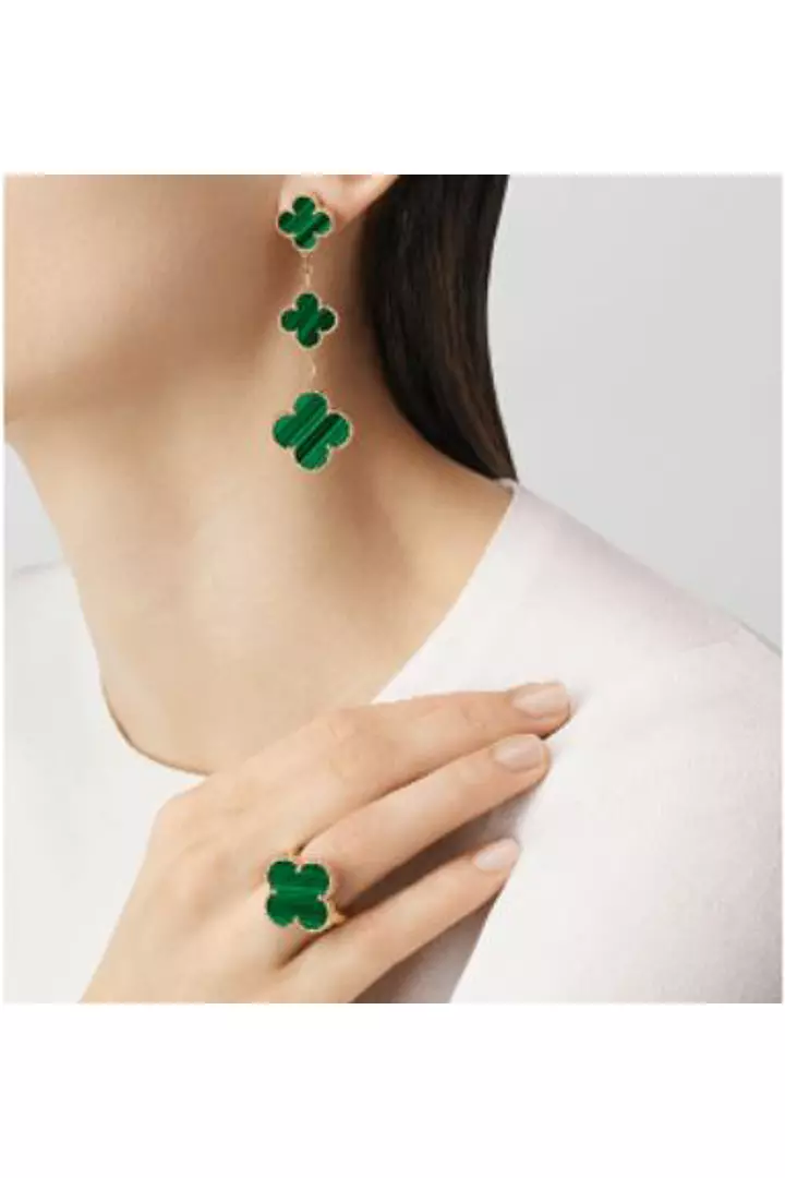 A model wearing the Van Cleef Triple Alhambra Green Malachite Earrings.
