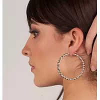 women wearing borrow large diamond hoop earrings