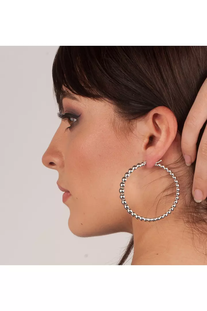 women wearing borrow large diamond hoop earrings