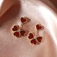 rent red alhambra earrings on satin