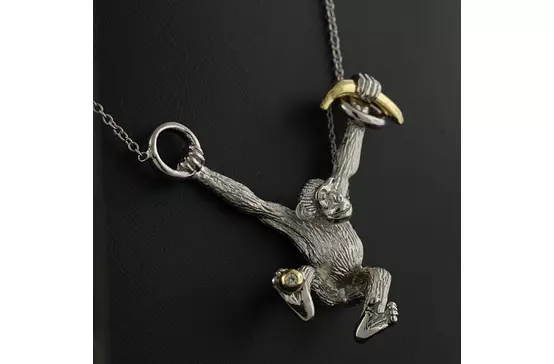 silver monkey necklace with gold banana for women