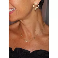 women wearing gold diamond chain necklace