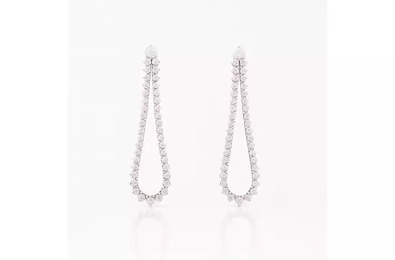 Rent teardrop shaped diamond tennis style drop earrings for a wedding