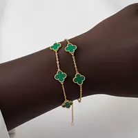 Rent green alhambra bracelet by Van Cleef on black 