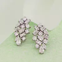 cluster diamond earrings for rent on model ear