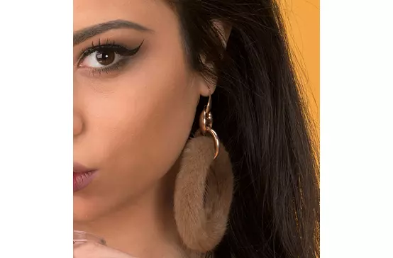 women wearing fur earrings