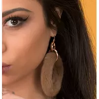 women wearing fur earrings