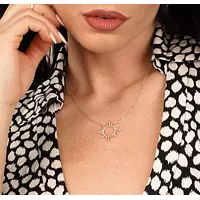 Burst pendant with diamonds for rent on model