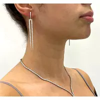 Pitchfork drop diamond earrings for rent on model