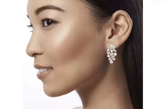 cluster diamond earrings for rent on model ear