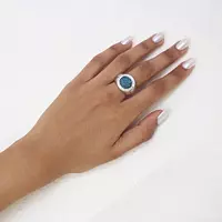 blue diamonds circle cocktail ring on a hand available for rent