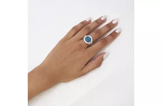 blue diamonds circle cocktail ring on a hand available for rent