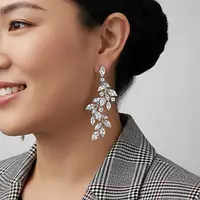 Rent diamond drop earrings with a leaf design on a woman