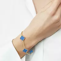 blue alhambra bracelet on a model