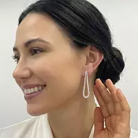 Rent teardrop shaped diamond tennis style drop earrings for a wedding