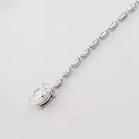 closeup of lariat oval shaped diamond tennis necklace