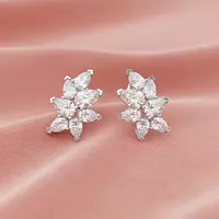 Diamond Cluster earrings on a model