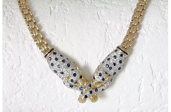 closeup of diamonds and sapphires tiger necklace