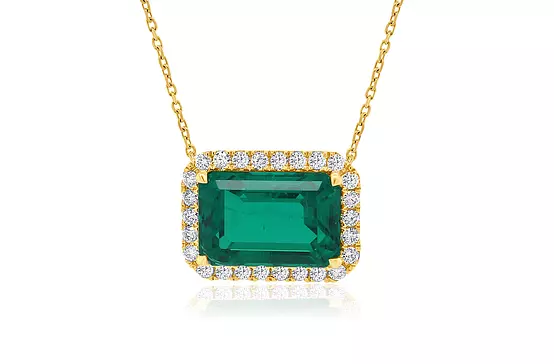 emerald and diamonds necklace for rent in a closeup
