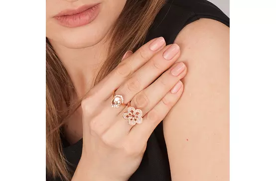  woman wearing the Diamond Flower Cocktail Ring along with another diamond ring