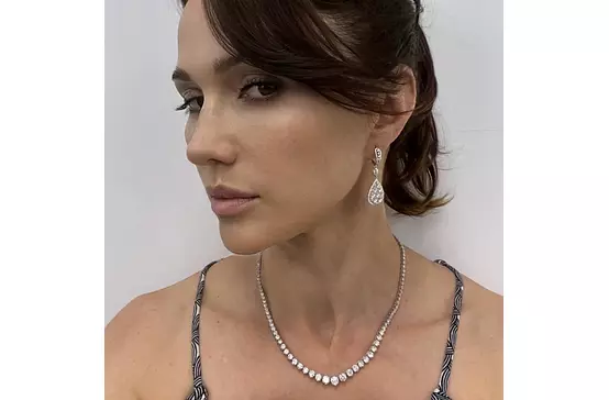 pear shaped diamond earrings on model for rent