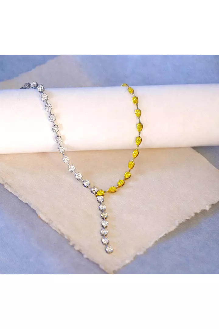 Diamond lariat necklace for rent with white and yellow diamonds
