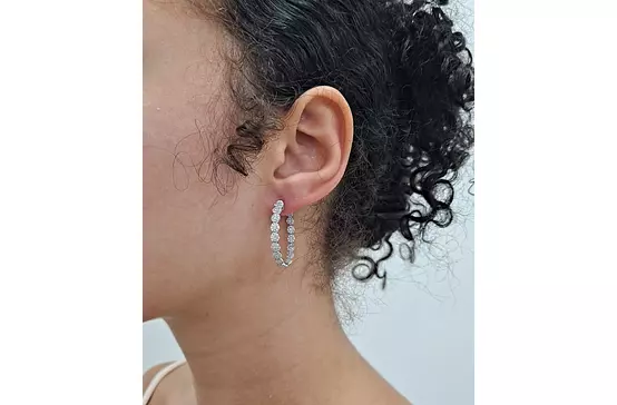 diamond hoop earrings on model to borrow