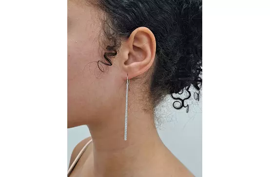 Diamond Stick earrings on a model