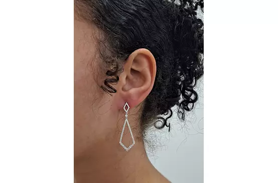 Open Space diamond drop earrings on model