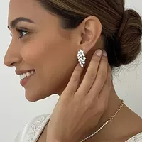 cluster diamond earrings for rent on model ear 