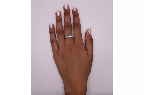 paraiba tourmaline and diamonds fashion ring on model hand