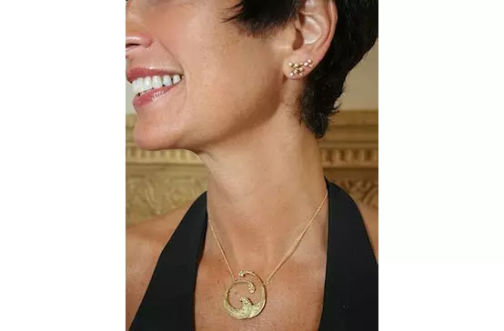 women wearing gold fashion necklace