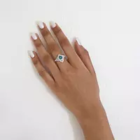 Blue diamond and white diamond cocktail ring on hand