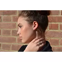 women wearing diamond stud earrings